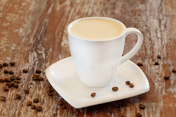 Coffee with milk, latte, cappuccino in a cup on a wooden background