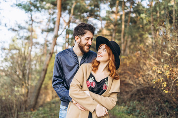 Happy young romantic couple spend time together outdoor.