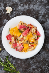 colored papardelle with chicken, bacon and mushrooms