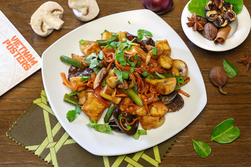 Chinese dish of chicken and rice on a plate, top view