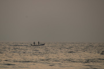 Fototapeta premium boat in sea at sunset