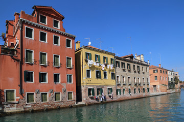 Fototapeta na wymiar Historical houses on a canal in Venice, Italy