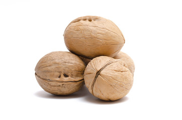 Heap of walnuts isolated on the white background.