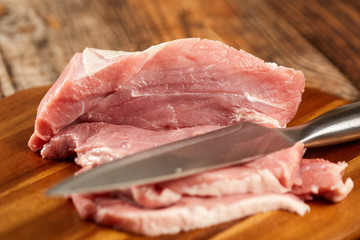 Pork leg and chef's knife