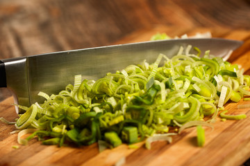 Chef's knife and sliced leek