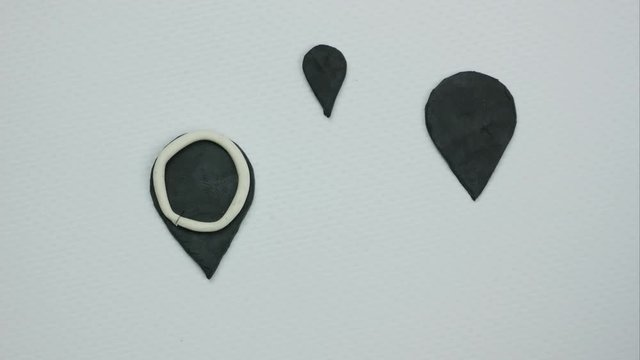 Black signs of location on the white background. Stop motion