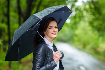 Woman with umbrella in the rain