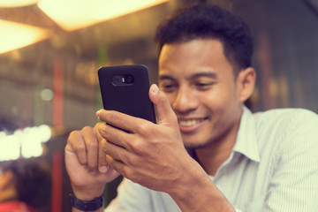 man play on smartphone concept 
