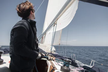 Fotobehang Sailor sets sail on a sailing yacht. © Denys