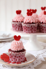 Red velvet cupcakes decorated for with red hearts for Valentine's day