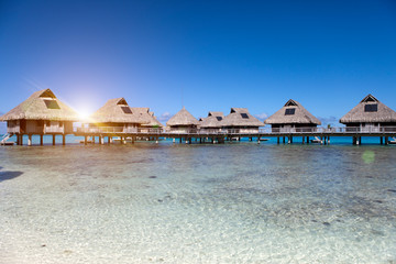 Typical Polynesian landscape -small houses on water.