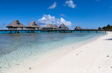 Typical Polynesian landscape -small houses on water.