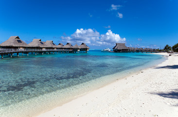 Typical Polynesian landscape -small houses on water.