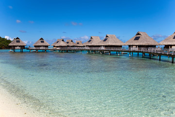 Typical Polynesian landscape -small houses on water.