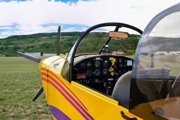 An airplane cockpit on an airfield