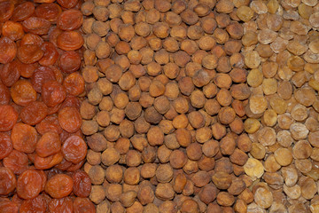 Rows of dried fruits: apricots, dried apricot, uruk. Dried fruit background.