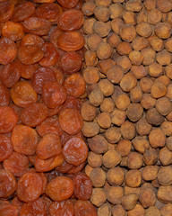 Rows of dried fruits: apricots, dried apricot, uruk. Dried fruit background.