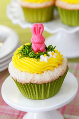 Easter cupcakes. Angel food cake with vanilla frosting and a candy bunny.