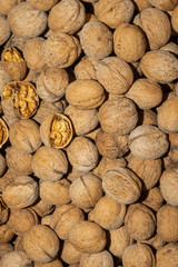 The collected walnuts are kept in bulk. Walnut in shell