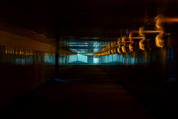 Dark Underpass with Dim Orange Lights