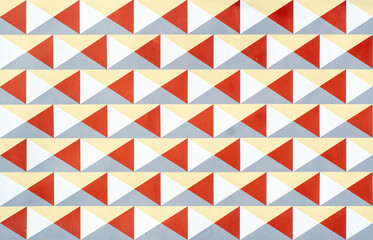 Geometric pattern of triangles on a concrete wall