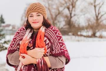 Christmas, winter holidays concept. Beautiful plus size woman walk at park. Love and peace for...