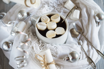 Cup of coffee and marshmallow in the New Year's Christmas table