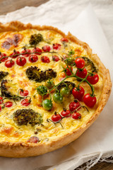 Savory pie with broccoli on white