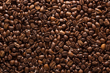 Coffee beans on the table background blurred abstract blurred