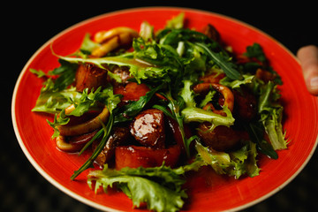 Calamari salad in red plate