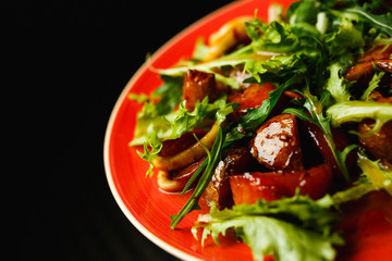 Calamari salad in red plate