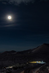 Industrial city at the foot of the mountain under the moon, Norilsk