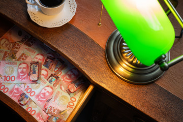 New Zealand dollars in a stylish desk drawer