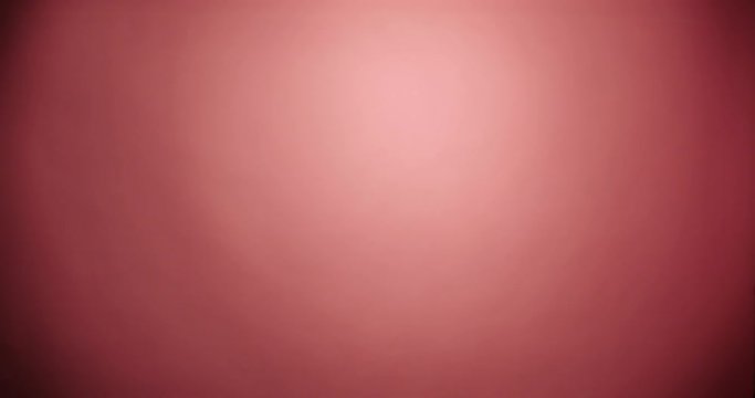 Brunette happy woman run into the shot and stand stoked and then run out with confetti in pink background wear red dress