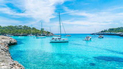 Landscape with boats and turquoise sea water on Cala Mondrago, Majorca island, Spain © Balate Dorin