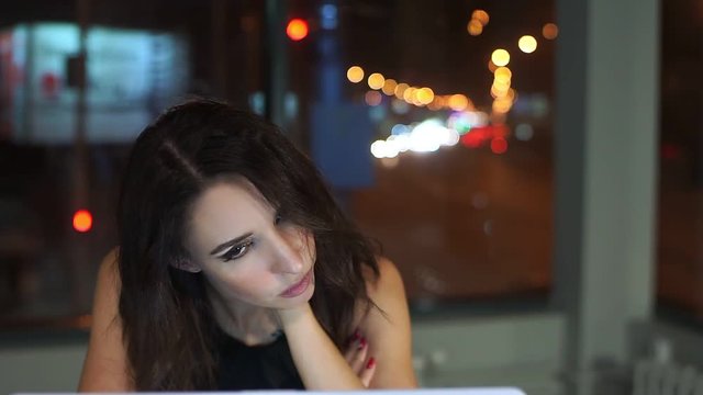 Female Manager, tired of working at laptop, sore neck and head.