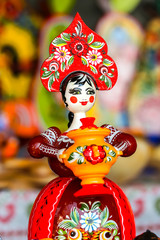 Traditional handicraft wooden souvenirs at street gift store near complex 