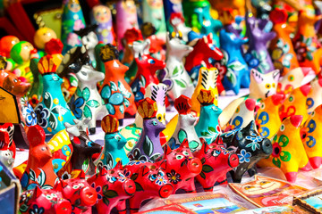 Fototapeta na wymiar Traditional handicraft wooden souvenirs at street gift store near complex 