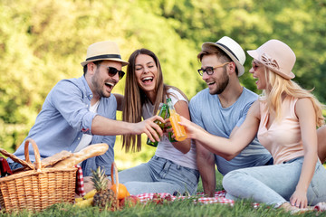 Friends on the picnic in nature.