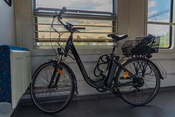 Fototapeta na wymiar Electric bicycle in czech train in sunny spring afternoon