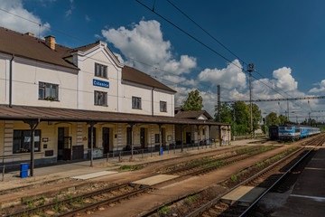 Fototapeta na wymiar Blue electric train in Cicenice station in spring sunny day