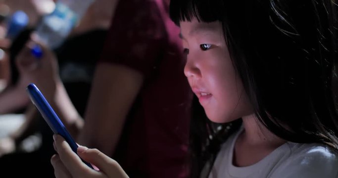 girl use smartphone at night