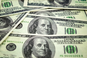 Dollar bills background with vignette effect.