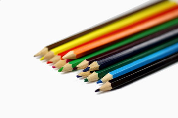 A group of colored pencils for child for drawing on a white background isolated