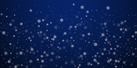 Fototapeta premium Sparse snowfall Christmas background. Subtle flyin