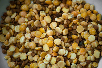 A mixture of dried cereals and legumes. Mixed peas and buckwheat. Entertaining lesson for kids. The development of fine motor skills. Go through the cereals