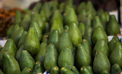 Pile of avocados background.