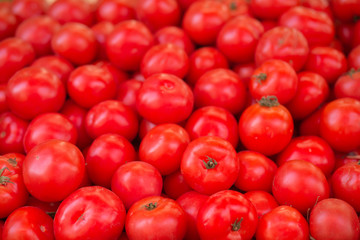 Pile of tomatoes background.
