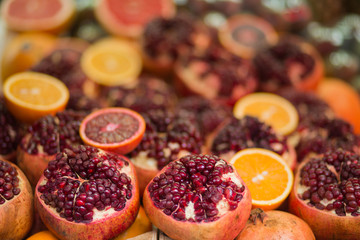 Pile of oranges and pomegranates background