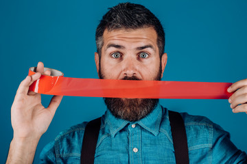 International Human Right day. man wrapping mouth by adhesive tape. censorship. Brutal bearded male. Concept freedom of speech and press. Mind control and propaganda. Censorship protest sign - obrazy, fototapety, plakaty